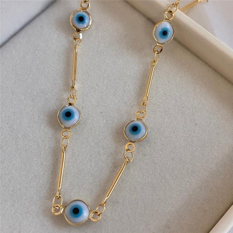 COLAR CHOKER COM DETALHES DE OLHO GREGO FOLHEADO A OURO 18K