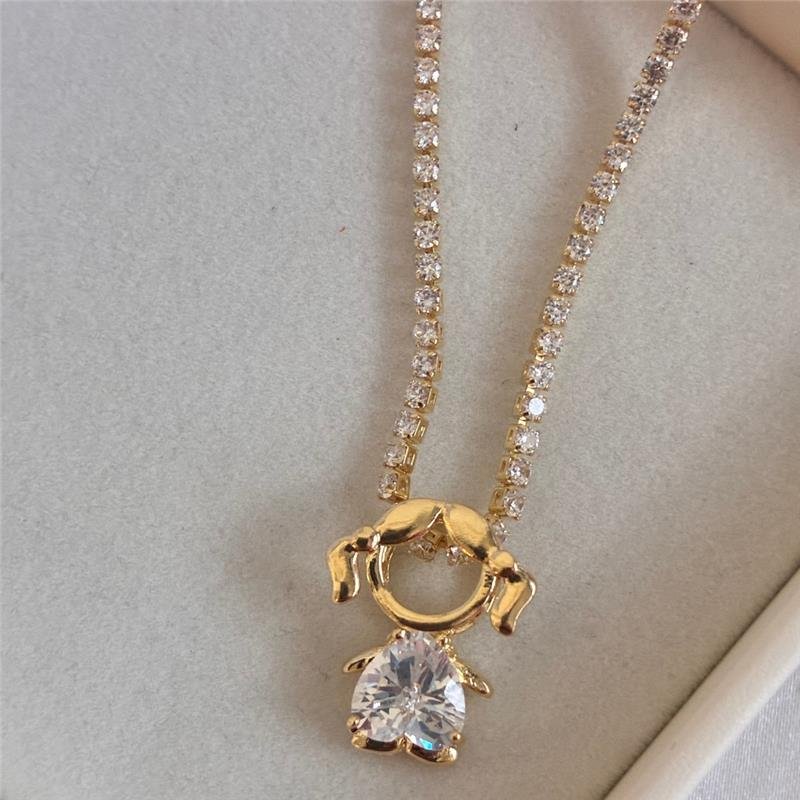 COLAR RIVIERA COM MENINO FOLHEADO A OURO 18K - 1 UN.